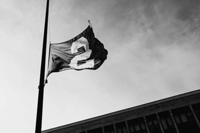 The block S flag of MSU, flying at half staff