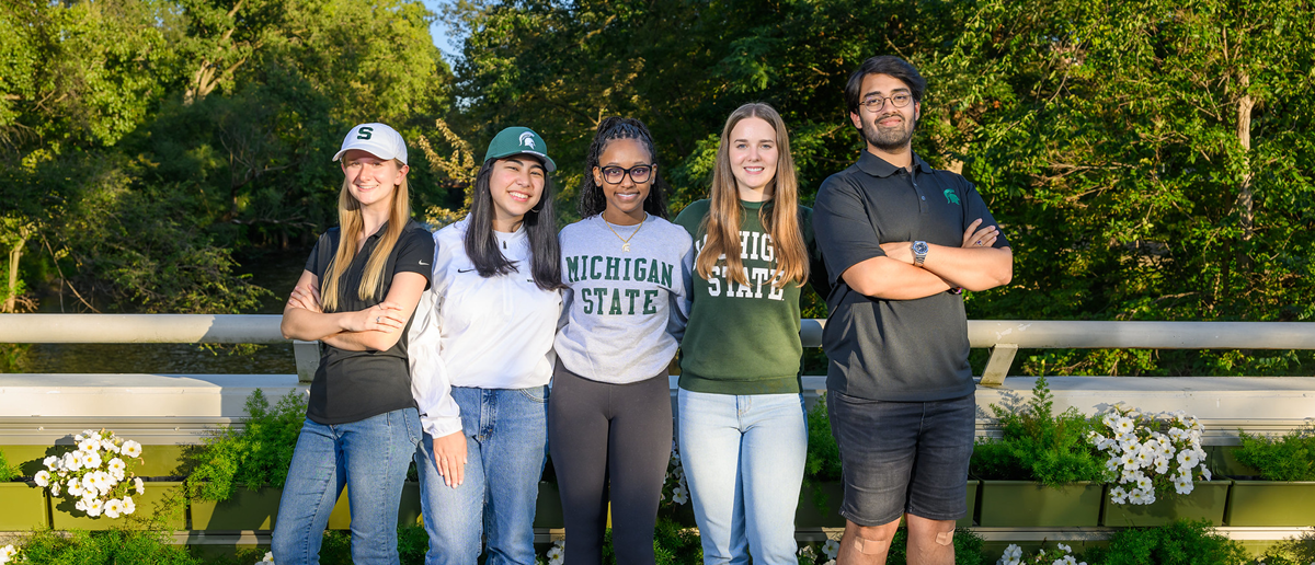 Kelsey Abner, center, with four other members of the 2023 Homecoming Court, all in Michigan State apparel