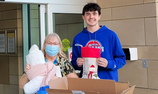 Jacob Weber brings holiday stockings to a VA medical center