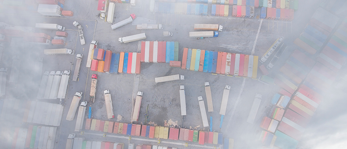 Shipping containers on trucks, viewed from high above