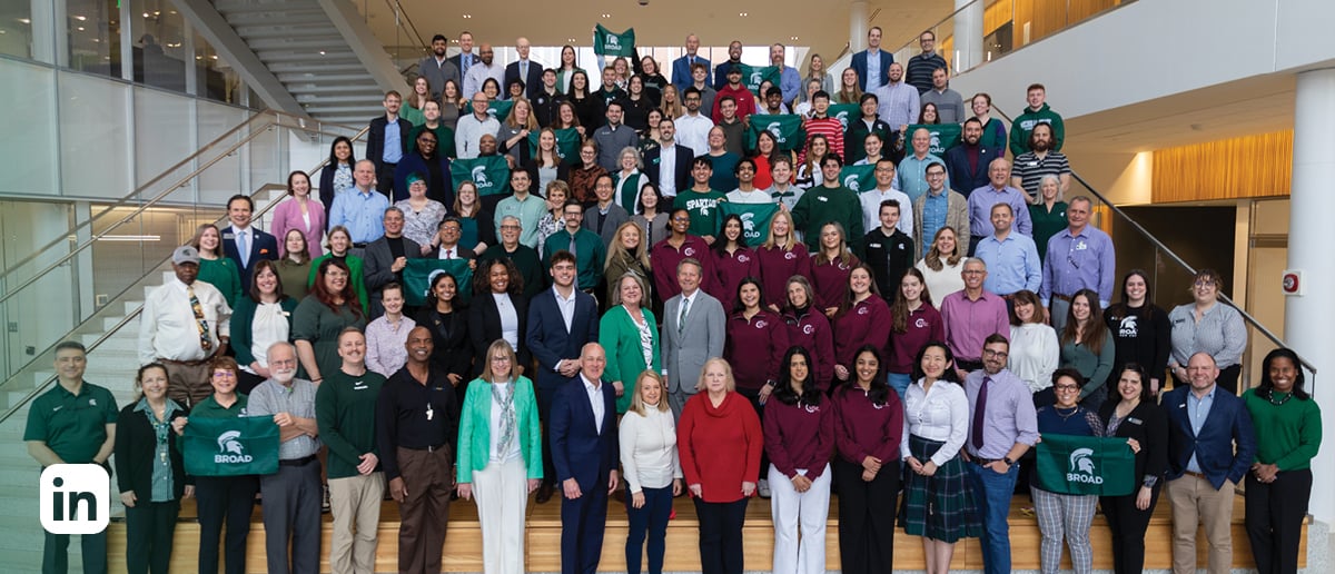 Dozens of Broad faculty, staff and students pose with MSU President Kevin Guskiewicz